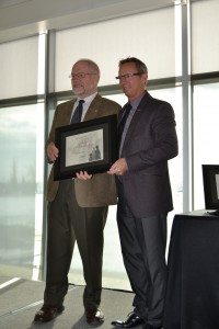 Chris Andersen receives the Board of Governors Award of Distinction from GPRC Board of Governors Chair, Pete Merlo