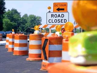 Section of 92nd Street down to one lane today