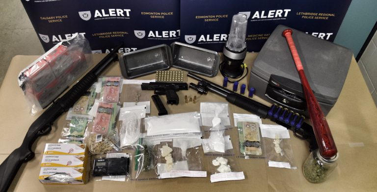 Drugs and guns seized from four Grande Prairie homes