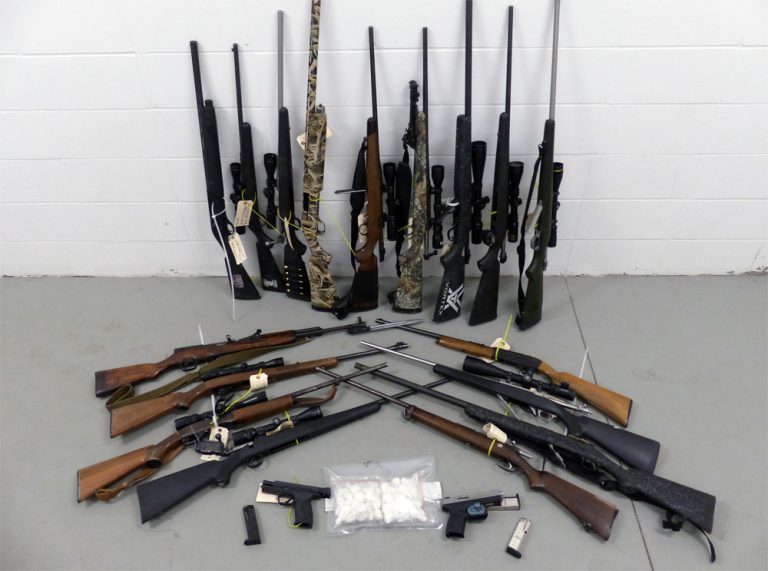 Arsenal of guns seized from alleged cocaine dealers