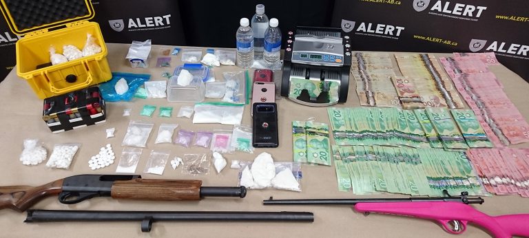 ALERT Grande Prairie seizes guns, drugs and cash from two homes