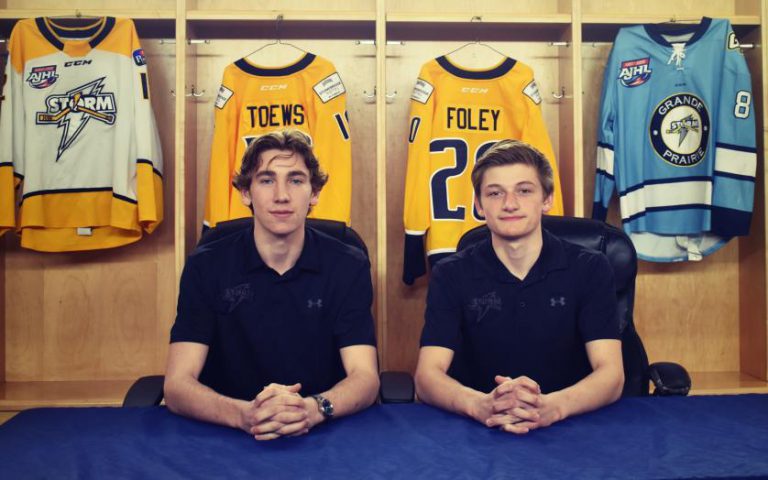 Storm signs two local players