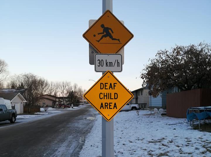 Sexsmith family thrilled after Deaf Child Area sign set up