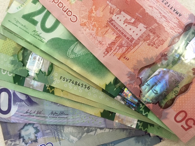 Stock image of Canadian money. (VistaRadio Stock Image)