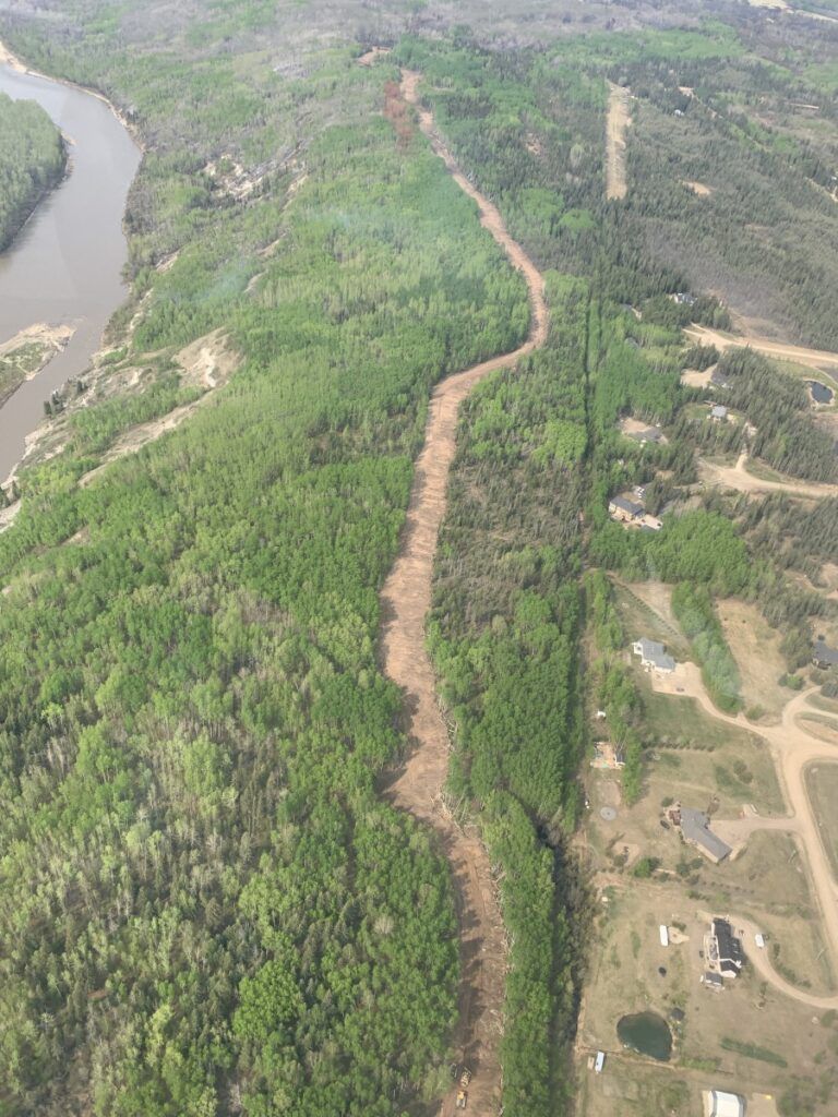 With challenging weather conditions expected, crews reinforcing Dunes West fire guards