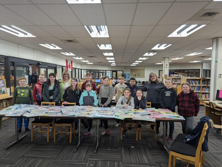 Bonanza School students donate 100 student-translated braille books to Crystal Park School library