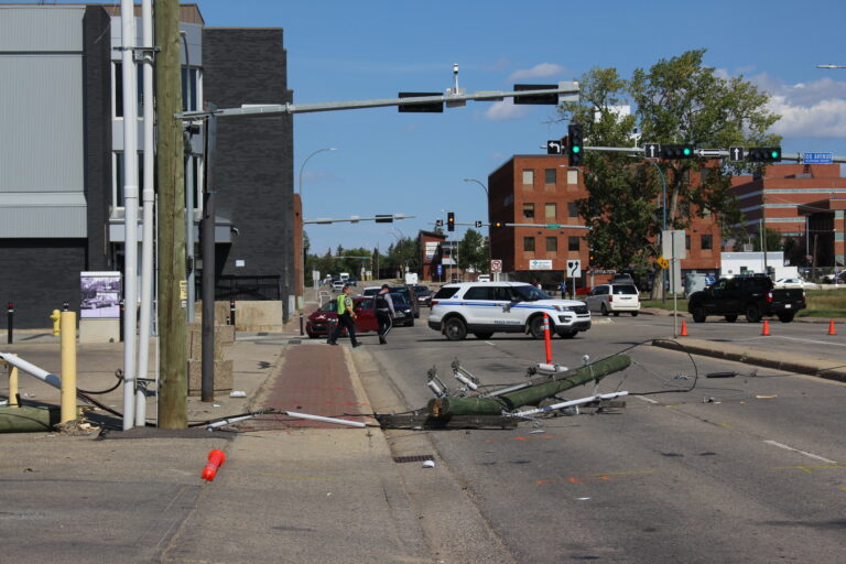 Part of 99th Street closed due to collision involving power line pole