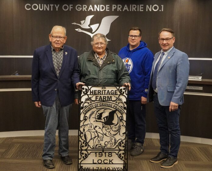 The Lock family accepts the Heritage Award in County Council Chambers (Supplied, County of GP)
