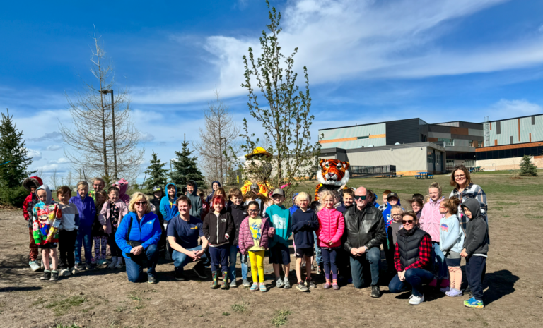 Harry Balfour students help celebrate Arbor Day early with crabapple tree planting