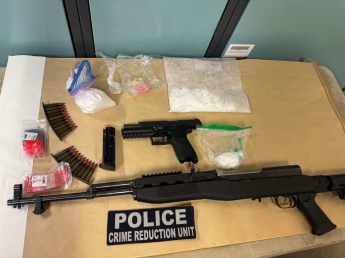 Guns and drugs allegedly seized from a stolen trailer on October 6th. (Supplied, Grande Prairie RCMP)